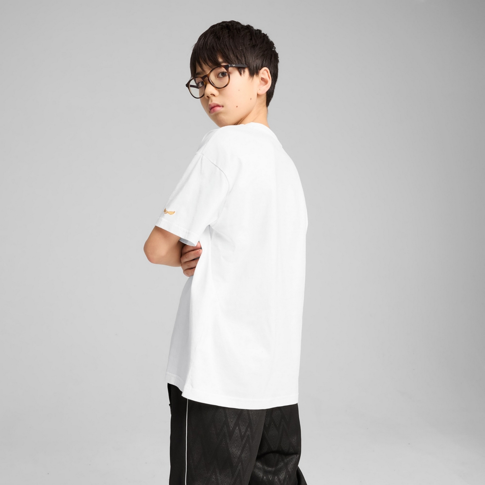 Koszulka ch�opi�ca Puma X HARRY POTTER RELAXED GRAPHIC bia�a 63007702