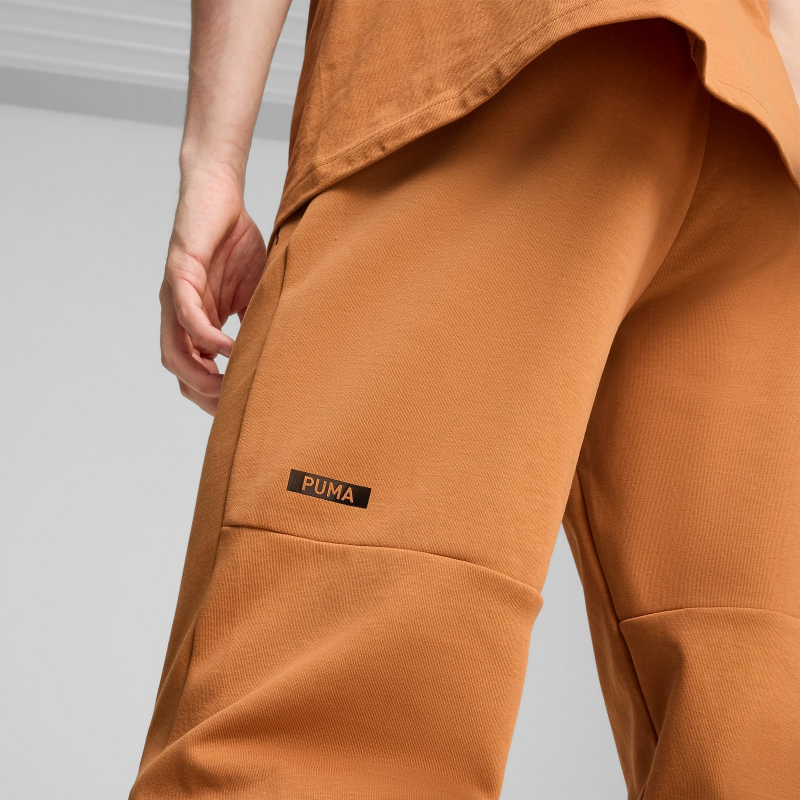 Spodnie dresowe mskie Puma RAD/CAL DK CL pomaraczowe 68162164