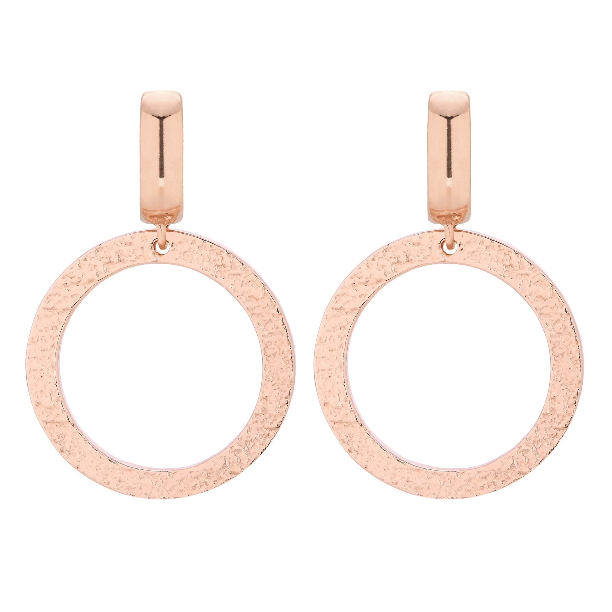 Duże kolczyki w różowym złocie z chropowatymi kołami