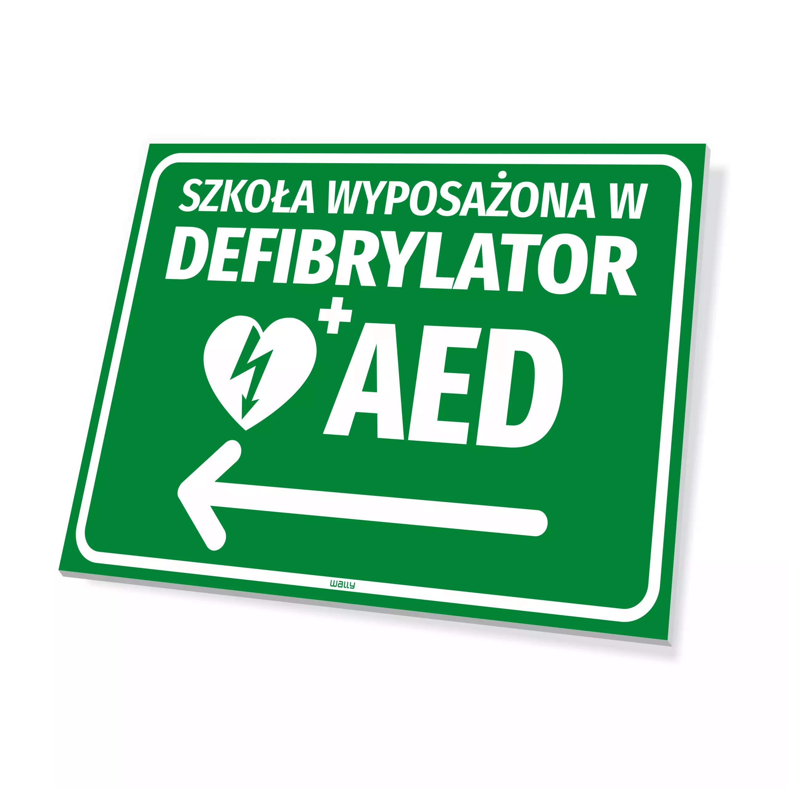 Tabliczka: szkoła wyposażona w defibrylator AED, kierunek w lewo