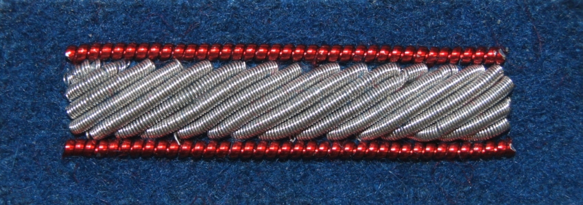 Stopień Wojska Polskiego haftowany bajorkiem do beretu niebieskiego - starszy szeregowy specjalista