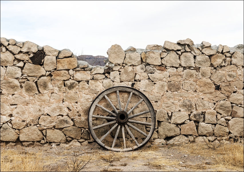 Image of Wagon wheel against a stone fence at Hueco Tanks State Park, northwest of El Paso, USA, Carol Highsmith - plakat Wymiar do wyboru: 30x20 cm